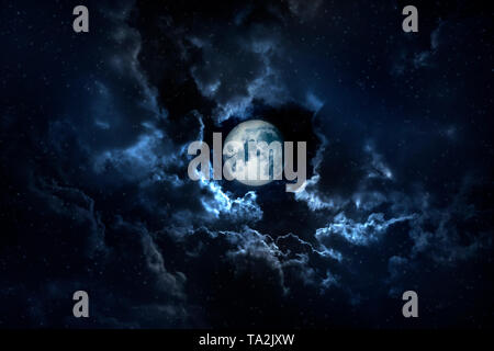 Full moon shining on the sky in cloudy day. Stock Photo