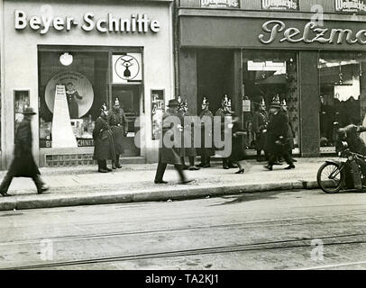 There are street fights between the Rotkaempferbund and the SA, during which the police secures the pavement opposite the Berlin City Hall. Stock Photo