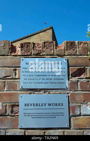 wall plaques commemorating the 1979 restoration of the adjacent beverley works gates, originally forming the entrance to an ironworks Stock Photo