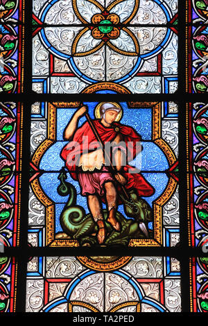 Saint-Georges terrassant le dragon. Vitrail. Saint-Eglise Saint-Clodoald. Saint-Cloud. Stained glass. Church St. Clodoald. Saint-Cloud. Stock Photo