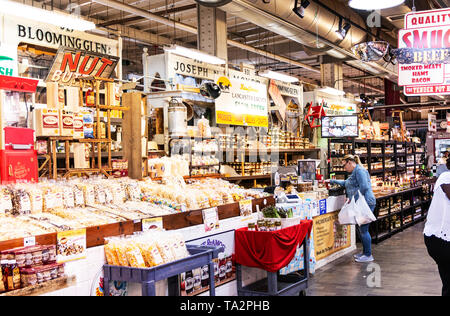 Philadelphia, Pennsylvania, USA - 26 April 2019: The inside of Reading Market with people shopping locally grown goods and popcorn. Stock Photo