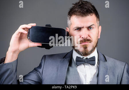 use future technology. Digital future and innovation. virtual reality goggles. Modern business. bearded man wear wireless VR glasses. businessman in VR headset. Visual reality. Using VR technologies. Stock Photo