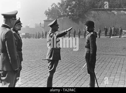 After the assassination of Reinhrad Heydrich, Wilhelm Frick is appointed Reich Protector of Bohemia and Moravia. Wilhelm Frick receives the report of the commander of the guard troop at the forecourt of Prague Castle. Stock Photo