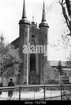 This is a photograph of the Oliwa Cathedral in Gdansk. It is dedicated to The Holy Trinity, Blessed Virgin Mary and St Bernard. The three-nave basilica was built at the end of the 12th century by the Cistercians and belonged to a monastery. In 1925, with the establishment of a diocese by Pope Paul VI, the church was raised to the dignity of a cathedral. Stock Photo