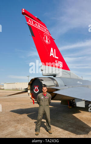 187th Fighter Wing of the Alabama Air National Guard, Tuskegee Airmen, red tail squadron pilot standing next to his McDonald Douglas F-16 fighter jet.