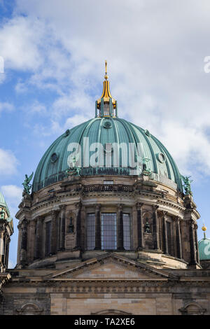 Close-up of upper part including the dome of the Berliner Dom (Berlin Cathedral), a historic landmark, in Berlin, Germany, on a sunny day.