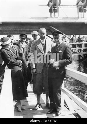 Crown Prince Wilhelm (2nd from right) looks at a Dornier DO-X airliner. Stock Photo