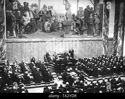 At the protest meeting in the auditorium of the Berlin National Library, Prime Minister Philipp Heinrich Scheidemann spoke against the adoption of the Versailles Treaty before the National Assembly. The dispute over the adoption has caused the government to break in two. This dispute lasts until 1933. Stock Photo