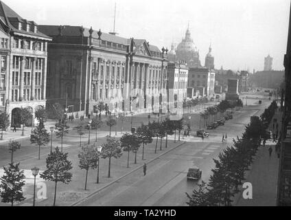 View of the boulevard Unter den Linden. Left, the Berlin State Library, the University of Berlin, in the background the Cathedral. The equestrian statue of Frederick the Great received a protective cover made of concrete to protect it from air attacks. Stock Photo