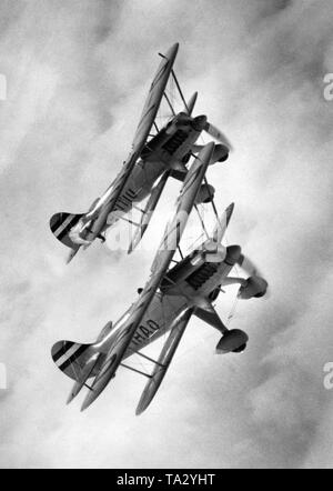 Two planes of the type Heinkel He 51 during a training flight of the Jagdgeschwader 'Richthofen'. The He 51 was produced between 1934 and 1937, starting 1936 was partly replaced by the Arado Ar 68 and starting 1937 extensively replaced by the Messerschmitt Bf 109 as a standard fighter aircraft. The picture is from the series: 'A day at the Jagdgeschwader Richthofen'. At this time, the Fliegergeschwader Doeberitz received the distinction 'Richthofen', but received the final name 'JG 2 Richthofen' only on 1.5.1939, under which it later participated in the Second World War. Stock Photo