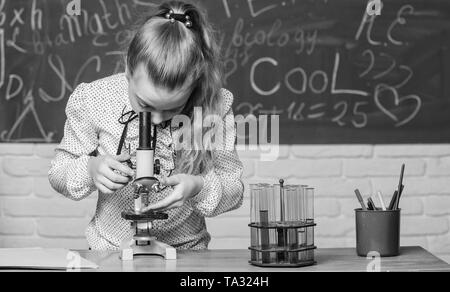 Life under microscope. science experiments in bilogy lab. Little scientist work with microscope. Chemistry research. Little girls in school lab. biology education. Biology lesson. Back to school. Stock Photo