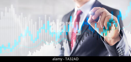 Stock trading candlestick chart and diagrams on blurred office center background. Stock Photo