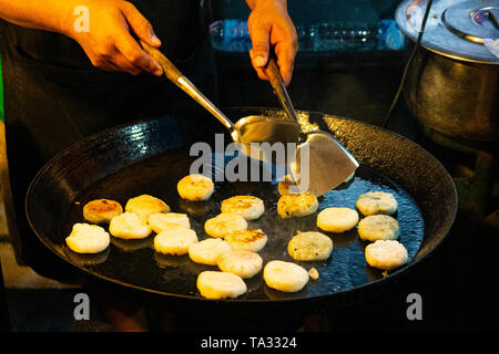 Vegan Dim Sum fried in a Thai Pan, Street food on Phuket Island during the Vegetarian Festival in Thailand, Asia Stock Photo