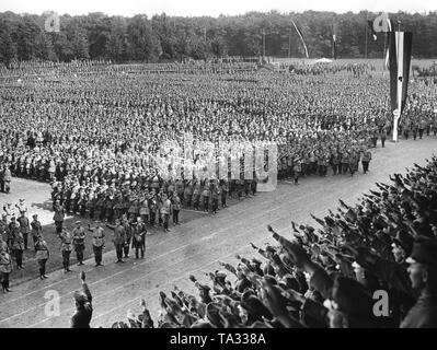 Members of the Stahlhelm show the Hitler salute in the stadium of Hanover while singing the Deutschlandlied (national anthem) and the Horst-Wessel-Lied. Stock Photo