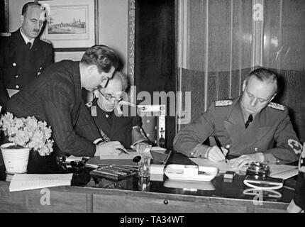 Joachim von Ribbentrop (right) signs the German-Slovakian Protection ...