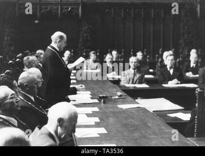 Mayor Karl Scharnagl, who was appointed by the Allies speaks to the 36 city councilmen during the first council meeting in the small meeting room of the Munich Town Hall. Stock Photo