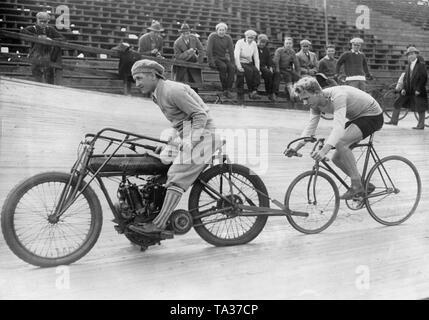 The track cyclist Bobby Walthour drives behind his pacer George Chapman on the cycle track in the Newark Velodrome in New Jersey in the United States. Stock Photo