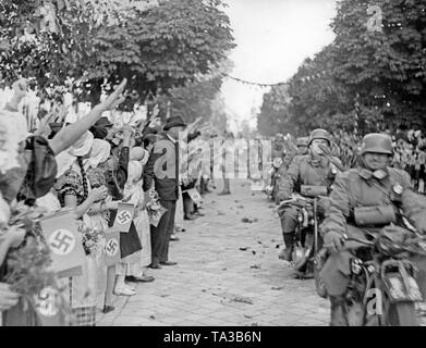 Motorized German troops enter Zuckmantel (today Zlate Hory) amid