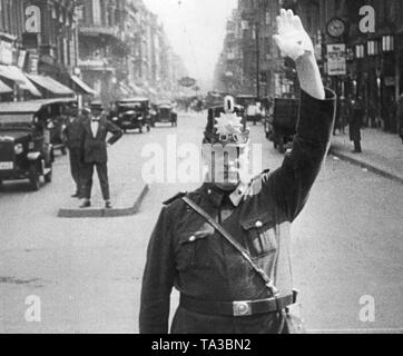 Scene from the film 'Berlin: Symphony of a Metropolis' by Walter Ruttmann. Here a traffic policeman regulates traffic. Stock Photo