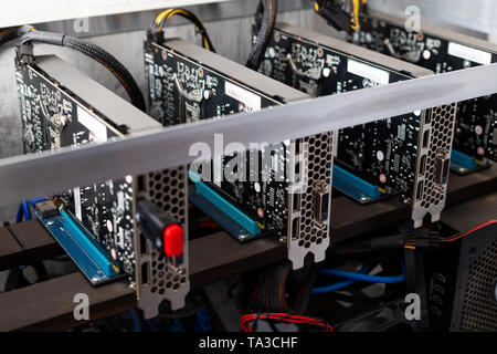 stopped domestic gpu cryptocurrency mining rig under layer of dust with selective focus Stock Photo