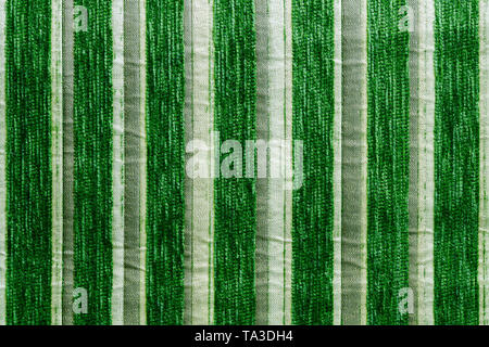 green striped synthetic woven upholstery fabric close-up texture and background Stock Photo