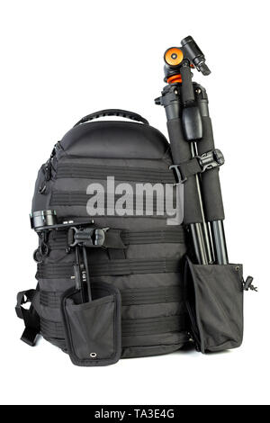 Black professional tactical molle black photo backpack with tripod and panoramic head isolated on white background. Stock Photo