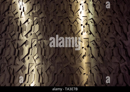 Light glow on grill pattern. Dark grainy industrial abstract background. Stock Photo