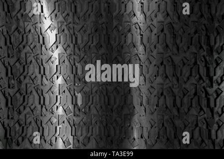 Light glow on grill pattern. Dark grainy industrial abstract background. Stock Photo