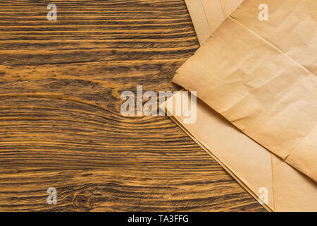 sheets of old paper on table Stock Photo
