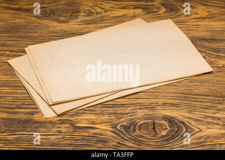 sheets of old paper on table Stock Photo
