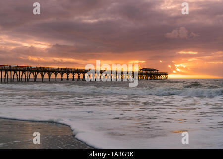 Morning sunrise along the ocean near pier in Myrtle Beach, South Carolina Stock Photo