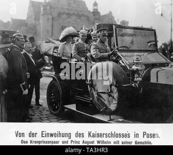 In the car Crown Prince Wilhelm of Prussia (behind the driver left) and Prince August Wilhelm of Prussia (right) drove to the inauguration of the castle built by William II. Behind them are their wives: Crown Princess Cecilie von Mecklenburg (left) and Princess Alexandra Viktoria of Schleswig-Holstein-Sonderburg-Gluecksburg (right). Stock Photo