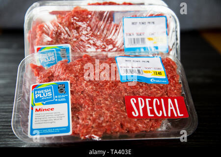 Packet of ground beef or minced beef from Fresh Choice supermarket. On plastic tray with plastic wrap or glad wrap, cling film. Bought on special. Stock Photo