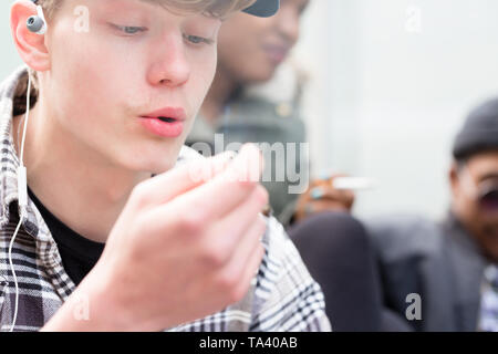 Close-up of young boy smoking Stock Photo