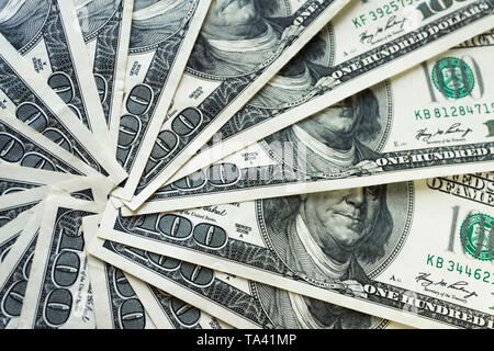 crolled stack of 100 dollar bills, close up banknote Stock Photo