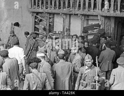 Photo of Spanish national troops in the patio of the Alcazar of Toledo after its liberation on September 26, 1936. Here, the Army and Guardia Civil. Stock Photo