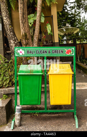 Bali, Indonesia - February 25, 2019: Ulun Danu Beratan Temple complex in Bedoegoel. Green and yellow trash cans. Stock Photo