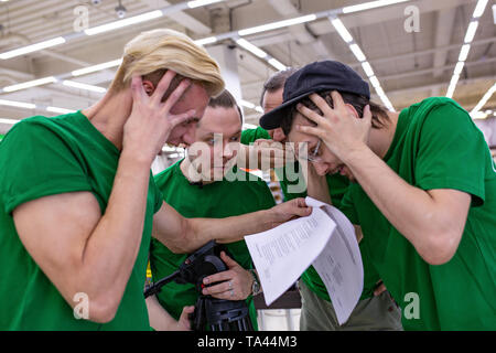 the team is shocked by the script, reading papers. backstage. Stock Photo