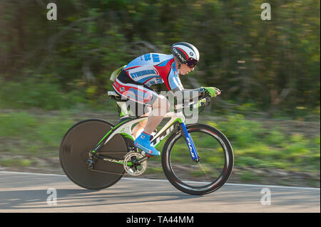 Racing in aero position in TT on time trial club event in summer evening leading up to Brands Hatch Stock Photo