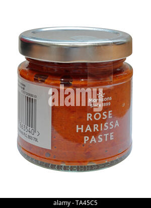 A Jar of Rose Harissa Paste by Morrisons isolated on a white background - Morrisons Since 1899 Stock Photo