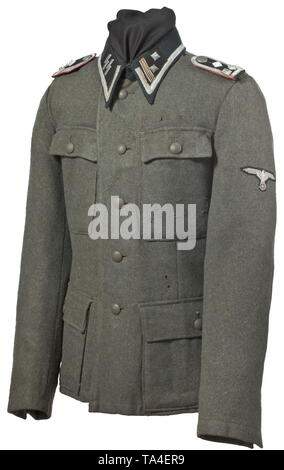 A field tunic M 43 for an SS-Sturmscharführer of the artillery depot piece, dated 1943 SS cut with five button holes and two belt holes, made of field-grey woollen cloth with metal buttons, the lining and the loops for the belt hook made of silver-grey Italian herringbone-patterned fabric, with SS clothing factory and size stamps on the inside. The tunic is customised for the wearer and fitted with a pointed dark-green collar, enlarged to attach the silver braiding signifying the rank of Unterführer. Both black collar patches adjusted to fit the shape of the collar, the rig, Editorial-Use-Only Stock Photo