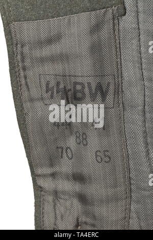 A field tunic M 43 for an SS-Sturmscharführer of the artillery depot piece, dated 1943 SS cut with five button holes and two belt holes, made of field-grey woollen cloth with metal buttons, the lining and the loops for the belt hook made of silver-grey Italian herringbone-patterned fabric, with SS clothing factory and size stamps on the inside. The tunic is customised for the wearer and fitted with a pointed dark-green collar, enlarged to attach the silver braiding signifying the rank of Unterführer. Both black collar patches adjusted to fit the shape of the collar, the rig, Editorial-Use-Only Stock Photo