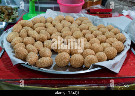 Ka Noom, a traditional Thai dessert fried in a pan during the Vegetarian Festival on Phuket Island in Thailand, Asia Stock Photo