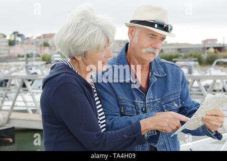 senior couple with map outside Stock Photo