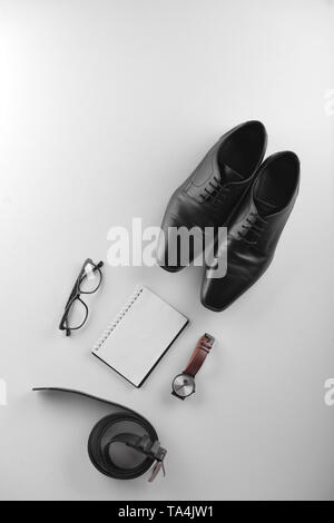 Stylish men's accessories with notebook on white background Stock Photo