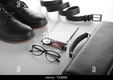 Stylish men's accessories with notebook on white background Stock Photo