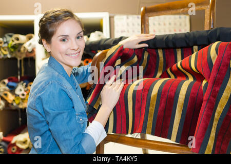 woman working in upholstery workshop Stock Photo