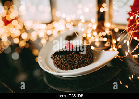 Mouth watering cream chocolate chip cake - cherry on top Stock Photo
