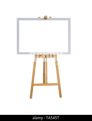 mock up empty blank white canvas board with realistic wooden easel stand isolated on white background with clipping path Stock Photo