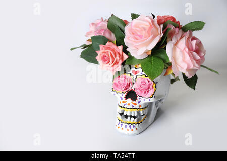Painted human skull with flowers for Mexico's Day of the Dead on white background Stock Photo